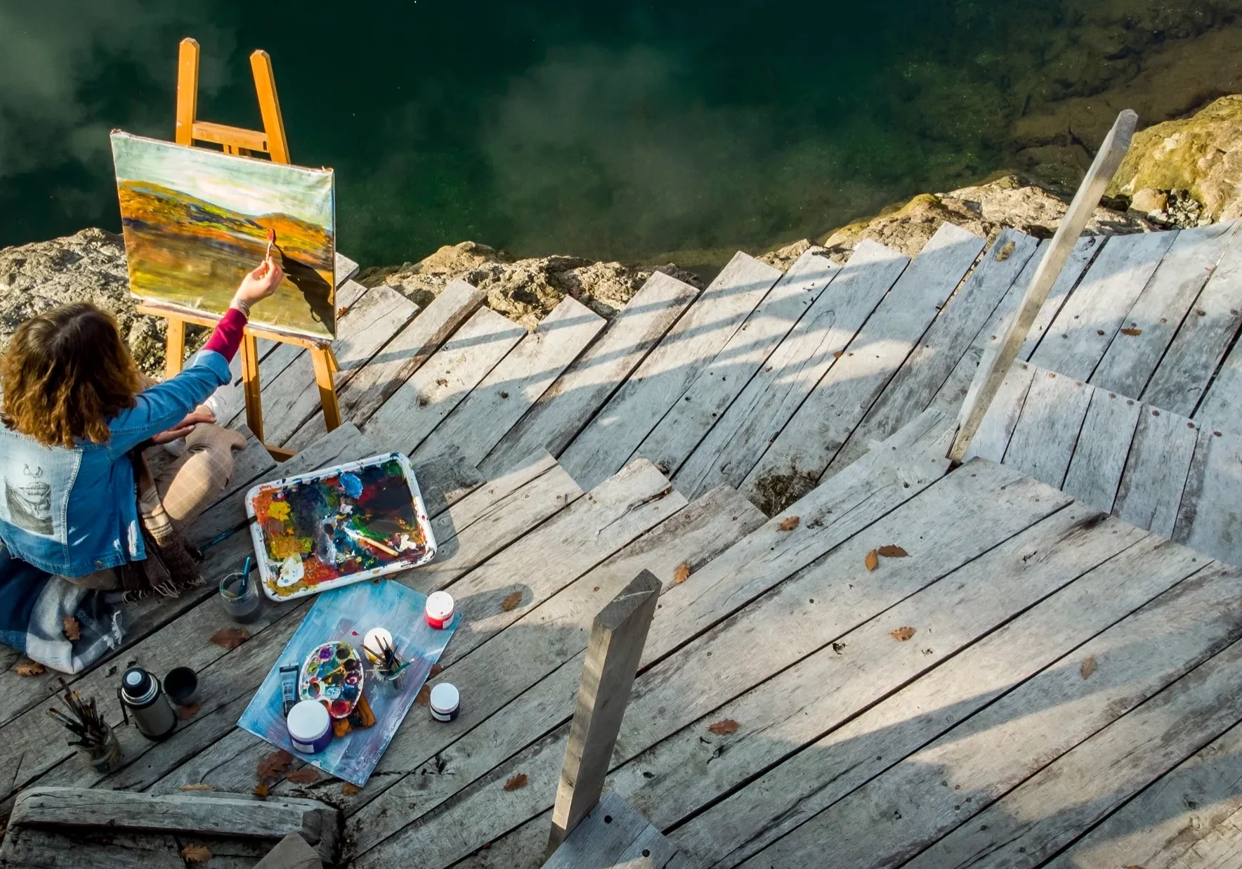 Woman creating art outdoors